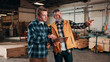 © peopleimages.com - Men, clipboard or meeting in lumber workshop, carpenter and apprentice with checklist and point. Discussion, trainee and mentor with feedback, notes for inventory management or carpentry guidelines