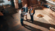 © peopleimages.com - People, carpenter and building discussion with tablet in workshop above for woodwork project. Top view, group or construction with contracting team for plan, carpentry design or furniture production