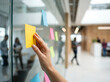 © Arif - Professional Creative Collaborative Planning Session Using Colorful Adhesive Notes on Office Glass Wall