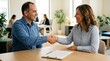 © Fajar Nuary - Business partners shaking hands after successful meeting and agreement