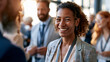 © Kateryna - Attractive diverse business people networking at a bright conference event candid professional interaction teamwork communication with copy space