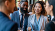 © Kateryna - Attractive diverse business people networking at a bright conference event candid professional interaction teamwork communication with copy space