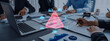 © InfiniteFlow - A team collaborates in a modern office setting, focusing on data analysis and security alerts, using a laptop and various documents to drive business strategies. Trope