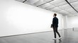 © Erlanggandi - A contemplative man in a modern professional suit walking through a spacious minimalist art gallery with large blank white walls
