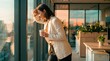 © Hypnyo - Businesswoman leaning against office window with coffee cup during sunset reflecting on work stress and mental health for career wellness