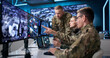 © Andrey Popov - Military Intelligence Team Using Computers In Office