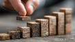 © Sadeeq - Businessman arranging wooden blocks showing path from idea to success symbolizing strategy growth achievement planning career advancement step-by-step goals and corporate motivation