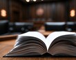 © Rudi - Open book rests on table in a dimly lit, formal room with blurred background