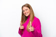 © luismolinero - Young caucasian woman isolated on white background pointing to the front and smiling