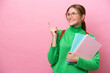 © luismolinero - Young caucasian student woman isolated on pink background intending to realizes the solution while lifting a finger up