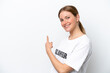 © luismolinero - Young volunteer woman isolated on white background pointing back