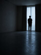© Pakpong - Silhouette person window curtain empty room alone moody standing shadow