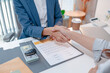 © PHOTO4U - Car purchase transaction with payment, contract signing, key handover, and customer agreement in a modern dealership office, representing automotive sales, business finance, and professional service.