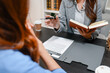 © PHOTO4U - Professional legal consultation between a lawyer and client discussing contracts, legal rights, case strategy, and document review in modern law office, representing justice, trust, and legal services