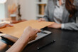 © PHOTO4U - Professional legal consultation between a lawyer and client discussing contracts, legal rights, case strategy, and document review in modern law office, representing justice, trust, and legal services