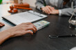 © PHOTO4U - Concept of bribery, corruption, and unethical business practices with cash offered during a legal contract meeting, highlighting financial crime, integrity, compliance, and corporate ethics.