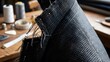 © 행운 행 - 옷깃에 꽂힌 시침핀과 가봉 중인 체크무늬 재킷 원단 디테일Sewing pins stuck in the collar of a tailored plaid jacket fabric detail