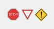 © IMRONI - Set of three common road traffic signs including stop yield and warning symbols.