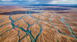 © Safkatmahmud - Dried cracked earth with riverbed patterns near ocean shoreline