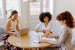 © BONNINSTUDIO/Stocksy - Business colleagues collaborating on project during office meeting