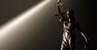 © vasyl pshyk - Statue of Lady Justice holding scales in light and shadow at a law office in the evening