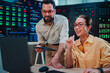 © Zamrznuti tonovi - Diverse it specialists collaborating on server management in a modern data center with advanced cybersecurity monitoring