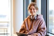 © Ирина Старикова - Progressive youth tech and education retail banner template featuring a cheerful female college student in cozy oversized hoodie holding a tablet device.