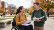 © Jafree - Students studying together on campus. Happy woman in wheelchair and man talking during class break. Education, university lifestyle, inclusion and friendship at college in autumn season