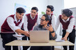 © Gatot - Asian School Teacher with His Hand While Discussing Lesson on Laptop with Four High School Students