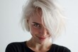 © Katya - Closeup portrait of a sly smiling blonde woman with minimal bright hair for portrait banner and profile design