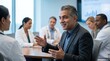 © Irina B - Professional discussion with healthcare experts in a conference setting focused on patient care strategies in a modern medical environment