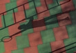 © VISTA by Westend61 - A boy casts a shadow while hanging from a playground ring