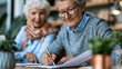 © Kateryna - Attractive senior couple signing life insurance or mortgage contract paperwork together at a bright home candid moment will loan application retirement with copy space