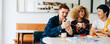© Julia - Friends enjoying coffee and laughter in casual meeting