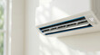 © Len_mik - Modern ductless mini split air conditioner mounted on a white wall. Wall unit AC with digital temperature display. Home climate control system