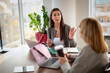 © gzorgz - Businesswoman sharing ideas during meeting in modern office