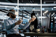 © DC Studio - Server facility software engineer programming equipment working with virtual reality technology. Server environment IT professional working with VR headset tech to update AI systems.