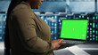© DC Studio - Programmer uses an isolated screen laptop in a server room for editable AI infrastructure review.