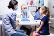 © DC Studio - Physician talks with a child during a clinic consultation, supporting pediatric care, medical communication and health examination.