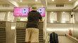 © Nazareno - Man checking in luggage at airport counter