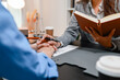 © PHOTO4U - Professional legal consultation between a lawyer and client discussing contracts, legal rights, case strategy, and document review in modern law office, representing justice, trust, and legal services