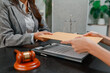 © PHOTO4U - Professional legal consultation between a lawyer and client discussing contracts, legal rights, case strategy, and document review in modern law office, representing justice, trust, and legal services