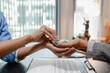 © PHOTO4U - Concept of bribery, corruption, and unethical business practices with cash offered during a legal contract meeting, highlighting financial crime, integrity, compliance, and corporate ethics.