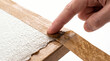 © DreamLab - Finger pressing wet brown gummed tape to stretch watercolor paper on wood board