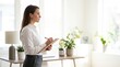 © Николай Срибяник - Professional woman in white shirt writing on clipboard in bright office