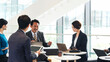 © metamorworks - ロビーで会議するビジネスパーソンのグループ
