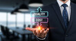 © MdSuhel - Businessman holding virtual quality and cost sign for business balance evaluation