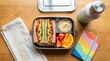 © FuturStockSolution  - Vegetable sandwich lunch box with fruit and hummus sandwich vegetables