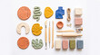 © Aromas - Kit de manualidades con arcilla polimérica de colores, herramientas de modelado, pintura y barniz sobre fondo blanco. Vista superior.