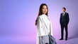© aril - Woman in white blazer smiles; man in suit stands nearby on a gradient purple background